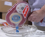 GlueDots Dot Shot pro applicator in use at Pyrex company